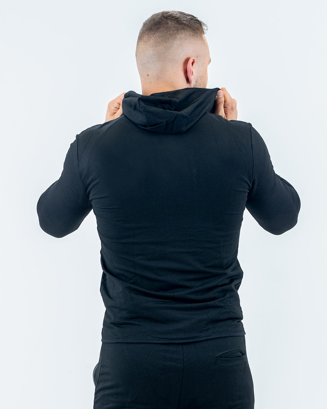 Aero jacket mighty black on model, thumb holes and high collar