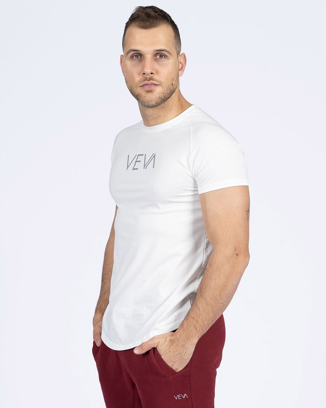 Ultra White Fit T-Shirt on model, fitted arms, relaxed midsection
